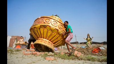 Workers carry a 'Mahakumbh Kalash' sculpture, days after the conclusion of Mahakumbh Mela, at the Sangam area in Prayagraj on Tuesday. (PTI) Workers carry a 'Mahakumbh Kalash' sculpture, days after the conclusion of Mahakumbh Mela, at the Sangam area in Prayagraj on Tuesday. (PTI)