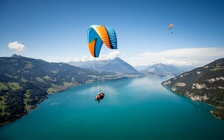 Soaring above the landscapes of Interlaken, Switzerland, with panoramic views of Lake Thun and the Alps. Soaring above the landscapes of Interlaken, Switzerland, with panoramic views of Lake Thun and the Alps.