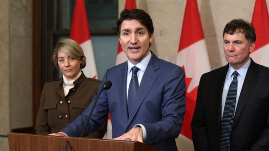 Canada's Prime Minister Justin Trudeau speaks during a news conference about the US tariffs against Canada on March 4, 2025 on Parliament Hill in Ottawa, as (L-R) Foreign Minister Melanie Joly, Minister of Finance and Intergovernmental Affairs Dominic Leblanc and Minister of Public Safety David McGuinty look on. (AFP)
