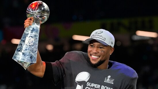 Philadelphia Eagles running back Saquon Barkley celebrates with the Vince Lombardi Trophy after the NFL Super Bowl 59 football game against the Kansas City Chiefs, Sunday, Feb. 9, 2025, in New Orleans. (AP)