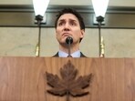 Canada's PM Justin Trudeau looks on during a press conference while responding to US President Donald Trump's orders to impose 25% tariffs on Canadian imports, in Ottawa.
