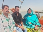 Pintu Mahra with his kin, including his mother, Shuklawati Mahra, on the Sangam banks in Prayagraj.