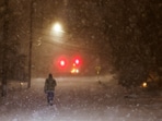 A man walks along an empty road during the pass of a polar vortex in Norwood, New Jersey, U.S.