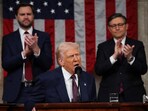 US President Donald Trump addresses a joint session of Congress at the US Capitol on March 04, 2025 in Washington, DC. Vice President JD Vance and Speaker of the House Mike Johnson  (R-LA) applaud behind.