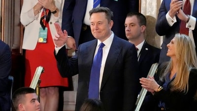 Elon Musk gestures as President Donald Trump addresses a joint session of Congress at the Capitol in Washington. (AP) Elon Musk gestures as President Donald Trump addresses a joint session of Congress at the Capitol in Washington. (AP)