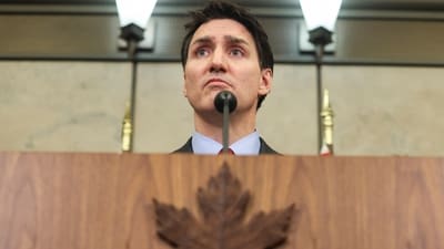 Canada's PM Justin Trudeau looks on during a press conference while responding to US President Donald Trump's orders to impose 25% tariffs on Canadian imports, in Ottawa. (Reuters)