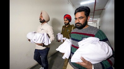 Police personnel with over 23kg heroin in Amritsar on Wednesday. (PTI) Police personnel with over 23kg heroin in Amritsar on Wednesday. (PTI)