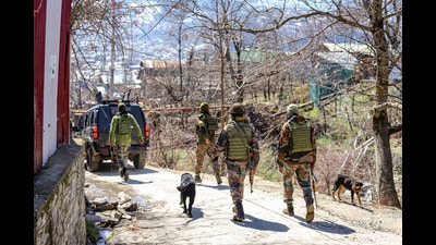 Security personnel cordon off the area after suspected grenade attack at a police post in Baramulla district on Wednesday. (PTI)