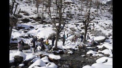 Tourists enjoy after fresh snowfall at Pahalgam in Anantnag district of south Kashmir on Wednesday. (PTI) Tourists enjoy after fresh snowfall at Pahalgam in Anantnag district of south Kashmir on Wednesday. (PTI)
