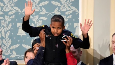 Devarjay "DJ" Daniel waves as President Donald Trump addresses a joint session of Congress in the House chamber at the U.S. Capitol in Washington, Tuesday, March 4, 2025. (AP) Devarjay "DJ" Daniel waves as President Donald Trump addresses a joint session of Congress in the House chamber at the U.S. Capitol in Washington, Tuesday, March 4, 2025. (AP)