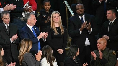 Stephanie Diller (C), widow of Jonathan Diller, an NYPD officer who was murdered in a traffic stop in March 2024, stands as she is recognized by US President Donald Trump during an address to a joint session of Congress in the House Chamber of the US Capitol in Washington, DC (AFP) Stephanie Diller (C), widow of Jonathan Diller, an NYPD officer who was murdered in a traffic stop in March 2024, stands as she is recognized by US President Donald Trump during an address to a joint session of Congress in the House Chamber of the US Capitol in Washington, DC (AFP)