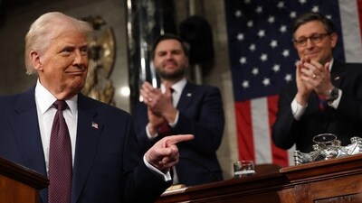 US Vice President JD Vance and Speaker of the House Mike Johnson (R-LA) applaud as US President Donald Trump speaks during an address to a joint session of Congress in the House Chamber of the US Capitol in Washington, DC, on Tuesday. (AFP)