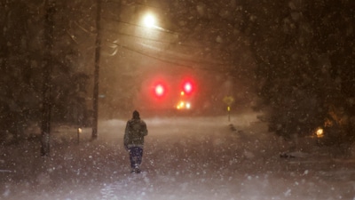 A man walks along an empty road during the pass of a polar vortex in Norwood, New Jersey, U.S. (REUTERS)