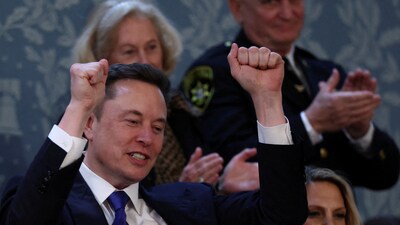 Elon Musk reacts on the day of President Donald Trump's speech to a joint session of Congress as the President refers to him and mentions his hardwork and praises him highly. (REUTERS)