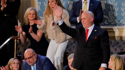 President Trump told the story of an Alabama steelworker wo has been working at the same steel plant for over 3 decades while also simultaneously acting as a volunteer firefighter captain as well as fostering nearly 40 children. In pic: Jeff Denard present at the time of the speech receives applause (REUTERS)