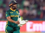 Cricket - ICC Men's Champions Trophy - Semi Final - South Africa v New Zealand - Gaddafi Stadium, Lahore, Pakistan - March 5, 2025 South Africa's Temba Bavuma walks back to the pavilion after losing his wicket, caught out by New Zealand's Kane Williamson off the bowling of Mitchell Santner REUTERS/Akhtar Soomro