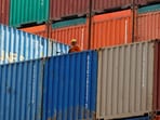 FILE PHOTO: A worker sits on a ship carrying containers at Mundra Port in the western Indian state of Gujarat April 1, 2014. REUTERS/Amit Dave/File Photo