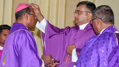 Ranchi, Mar 05 (ANI): A Catholic Church Priest applies the sacred ash on the forehead of Archbishop Vincent Aind on the first day of Lent, in Ranchi on Wednesday. (ANI Photo) (Somnath Sen) Ranchi, Mar 05 (ANI): A Catholic Church Priest applies the sacred ash on the forehead of Archbishop Vincent Aind on the first day of Lent, in Ranchi on Wednesday. (ANI Photo) (Somnath Sen)