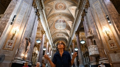 A woman prays during the celebration of Ash Wednesday at the Basilica San Jose de Flores in Buenos Aires on March 5, 2025. The Basilica de San Jose de Flores was the church where Pope Francis was inspired to consecrate his life to God and the Catholic Church. Pope Francis's condition was stable on Wednesday as he neared three weeks in the hospital battling pneumonia, a Vatican source said, with celebrations for the Lent religious season starting without him. (Photo by LUIS ROBAYO / AFP) (AFP) A woman prays during the celebration of Ash Wednesday at the Basilica San Jose de Flores in Buenos Aires on March 5, 2025. The Basilica de San Jose de Flores was the church where Pope Francis was inspired to consecrate his life to God and the Catholic Church. Pope Francis's condition was stable on Wednesday as he neared three weeks in the hospital battling pneumonia, a Vatican source said, with celebrations for the Lent religious season starting without him. (Photo by LUIS ROBAYO / AFP) (AFP)