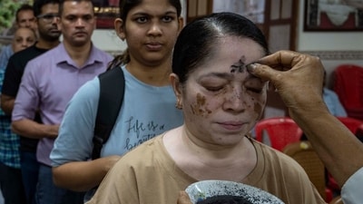 Mumbai, India - March 5, 2025: A Catholic priest marks the symbol of the cross with ash on the forehead of a devotee during an Ash Wednesday at St. Andrew's Church, Bandra in Mumbai, India, on Wednesday, March 5, 2025. (Photo by Satish Bate/ Hindustan Times) (Hindustan Times) Mumbai, India - March 5, 2025: A Catholic priest marks the symbol of the cross with ash on the forehead of a devotee during an Ash Wednesday at St. Andrew's Church, Bandra in Mumbai, India, on Wednesday, March 5, 2025. (Photo by Satish Bate/ Hindustan Times) (Hindustan Times)
