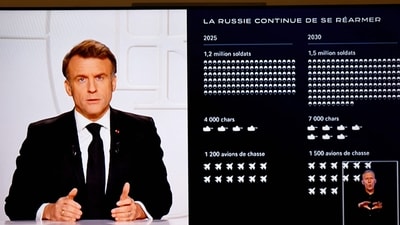 This photograph taken on March 5, 2025, shows a television screen broadcasting France's President Emmanuel Macron (L) addressing a live interview next to a graph showing the projected evolution of the Russian army on French TV at the Elysee Presidential Palace in Paris. (AFP) This photograph taken on March 5, 2025, shows a television screen broadcasting France's President Emmanuel Macron (L) addressing a live interview next to a graph showing the projected evolution of the Russian army on French TV at the Elysee Presidential Palace in Paris. (AFP)