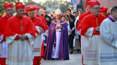 Italian cardinal Angelo De Donatis (C) arrives with a procession at the Church of Saint Sabina in Rome during the celebration of Ash Wednesday mass on March 5, 2025. Pope Francis's condition was stable on March 5, 2025 as he neared three weeks in hospital battling pneumonia, a Vatican source said, with celebrations for the Lent religious season starting without him. (Photo by Andreas SOLARO / AFP) (AFP) Italian cardinal Angelo De Donatis (C) arrives with a procession at the Church of Saint Sabina in Rome during the celebration of Ash Wednesday mass on March 5, 2025. Pope Francis's condition was stable on March 5, 2025 as he neared three weeks in hospital battling pneumonia, a Vatican source said, with celebrations for the Lent religious season starting without him. (Photo by Andreas SOLARO / AFP) (AFP)