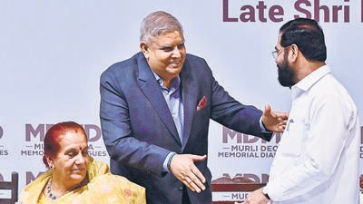 Mumbai, India - March 6, 2025: Vice president, Jagdeep Dhankhar, Dr Sudesh Dhankhar (wife) shares light moment with Dy CM Eknath Shinde, during "Murli Deora Memorial Dialogues" on theme "Leadership and Governance" at Royal Opera House, in Mumbai, India, on Thursday, March 6, 2025. (Photo by Anshuman Poyrekar/ Hindustan Times) (Hindustan Times)