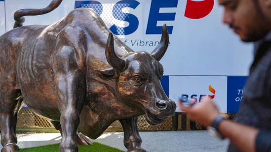 Stock market news: A man walks past the bull statue at BSE building in Mumbai. (PTI)