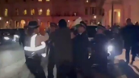 The tall and bearded man jostled with police personnel and stood in front of the vehicle before tearing the Indian flag (X/ video screengrab) The tall and bearded man jostled with police personnel and stood in front of the vehicle before tearing the Indian flag (X/ video screengrab)