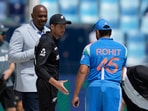 New Zealand's captain Mitch Santner, center, greets India's captain Rohit Sharma after the coin toss New Zealand's captain Mitch Santner, center, greets India's captain Rohit Sharma after the coin toss