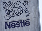 A Swiss flag flutters on the headquarters of Nestle in Vevey, Switzerland, November 25, 2024. REUTERS/Denis Balibouse