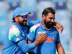 Mohammed Shami and Rohit Sharma celebrate the dismissal of Australia's captain Steven Smith during the 1st Semi-Final (A1 v B2) in the ICC Champions Trophy, 2025, at Dubai International Cricket Stadium in Dubai on Tuesday. 