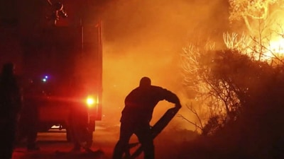 As workers attempted to contain the fires, over 200,000 people were at one time under evacuation orders. In the days and weeks that followed, authorities declared that several neighborhoods evacuated due to the Palisades and Eaton fires would only be partially repopulated. (REUTERS)