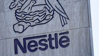 A Swiss flag flutters on the headquarters of Nestle in Vevey, Switzerland, November 25, 2024. REUTERS/Denis Balibouse