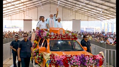 Prime Minister Narendra Modi with Union Minister C.R. Patil and Gujarat Chief Minister Bhupendra Patel during the launch of Surat Food Security Saturation Campaign, in Surat, Gujarat. (PTI) Prime Minister Narendra Modi with Union Minister C.R. Patil and Gujarat Chief Minister Bhupendra Patel during the launch of Surat Food Security Saturation Campaign, in Surat, Gujarat. (PTI)