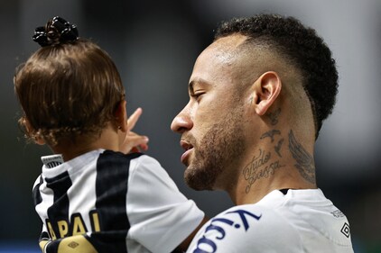 Neymar Jr with his daugther Helena. (Fernanda Luz/Reuters)