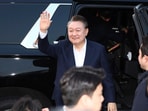 Impeached South Korean President Yoon Suk Yeol greets to his supporters upon his arrival outside of presidential residence in Seoul, South Korea, Saturday, March 8, 2025. Impeached South Korean President Yoon Suk Yeol greets to his supporters upon his arrival outside of presidential residence in Seoul, South Korea, Saturday, March 8, 2025.