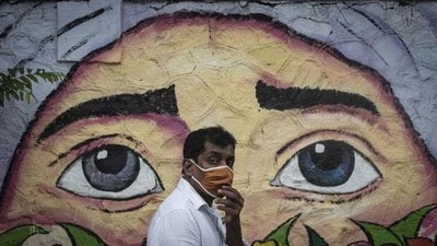 A masked man walks past graffiti in Pune, in 2020. (HT Archives) A masked man walks past graffiti in Pune, in 2020. (HT Archives)