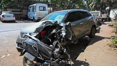 The car driver, Siddhesh Rupesh Belkar, lost control of the vehicle and it hit the road divider, crossed over to the adjacent lane and crashed into the scooter. (Raju Shinde/HT Photo)