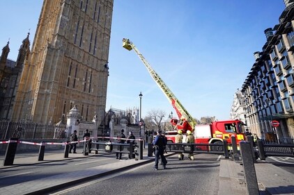 Emergency services at the Palace of Westminster in London after a man with a Palestine flag climbed up Elizabeth Tower, which houses Big Ben. (AP)