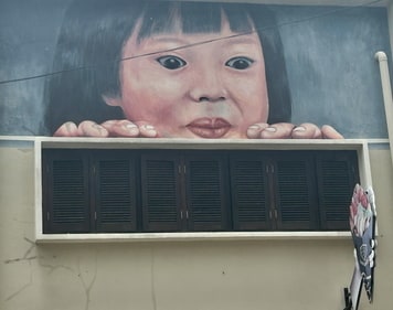 A little girl staring at an ice cream cone is one of the most photographed
street art in Petaling. (Photo: Preeti Verma Lal) A little girl staring at an ice cream cone is one of the most photographed
street art in Petaling. (Photo: Preeti Verma Lal)