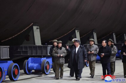 North Korea's leader Kim Jong Un inspects a nuclear submarine during a visit to a shipyard, in this photo released by North Korea's official Korean Central News Agency on March 8, 2025. (KCNA via Reuters)