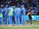 New Zealand's Daryl Mitchell walks back to the pavilion after losing his wicket during their Group A fixture vs India.