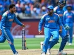 India's Kuldeep Yadav (L) celebrates after bowling out New Zealand's Rachin Ravindra India's Kuldeep Yadav (L) celebrates after bowling out New Zealand's Rachin Ravindra
