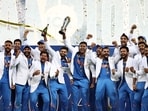 India's players celebrate with the trophy after winning the ICC Champions Trophy India's players celebrate with the trophy after winning the ICC Champions Trophy