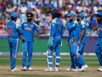 India's Ravindra Jadeja, second left, speaks to captain Rohit Sharma before asking for review. India's Ravindra Jadeja, second left, speaks to captain Rohit Sharma before asking for review.