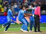 India's players celebrate their victory during the ICC Champions Trophy one-day international (ODI) final cricket match between India and New Zealand at the Dubai International Stadium in Dubai on Sunday. India's players celebrate their victory during the ICC Champions Trophy one-day international (ODI) final cricket match between India and New Zealand at the Dubai International Stadium in Dubai on Sunday.