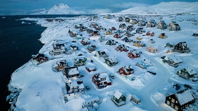 Houses covered by snow are seen on the coast of a sea inlet of Nuuk, Greenland. (AP Photo/Evgeniy Maloletka) Houses covered by snow are seen on the coast of a sea inlet of Nuuk, Greenland. (AP Photo/Evgeniy Maloletka)