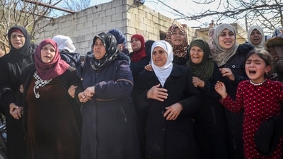 Witnesses told the Associated Press that women were reportedly stripped and paraded naked in the streets before being shot dead, amid the horrifying scenes of violence. (Omar Albam/AP) Witnesses told the Associated Press that women were reportedly stripped and paraded naked in the streets before being shot dead, amid the horrifying scenes of violence. (Omar Albam/AP)