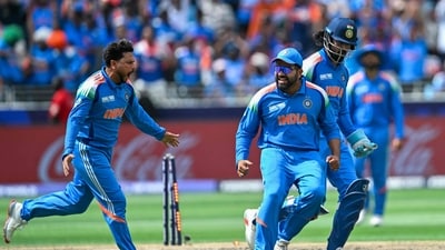 India's Kuldeep Yadav (L) celebrates after bowling out New Zealand's Rachin Ravindra (AFP) India's Kuldeep Yadav (L) celebrates after bowling out New Zealand's Rachin Ravindra (AFP)